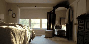 GIF of reviewer&#x27;s motorized curtain rising