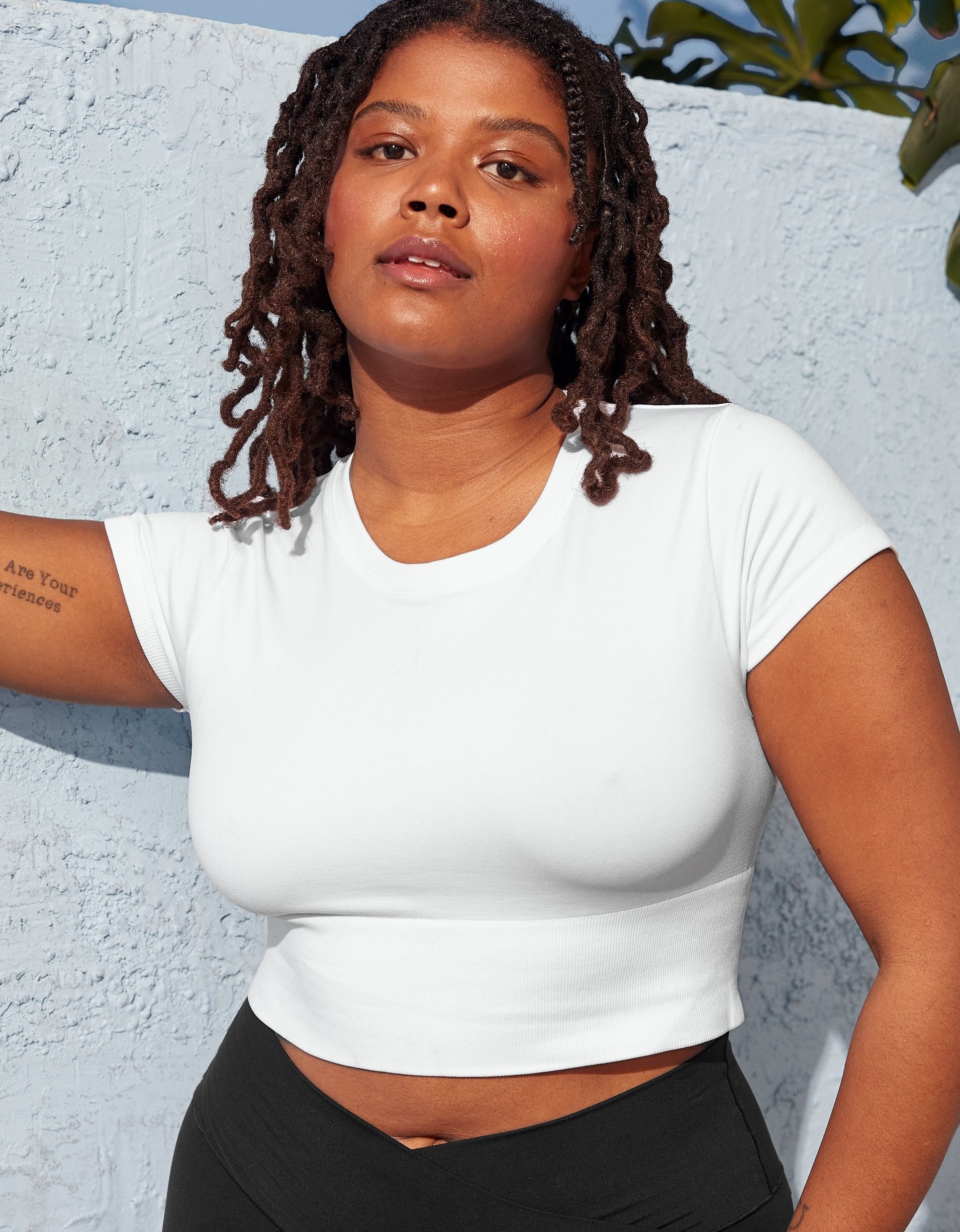 model in a the white cropped tee with short sleeves