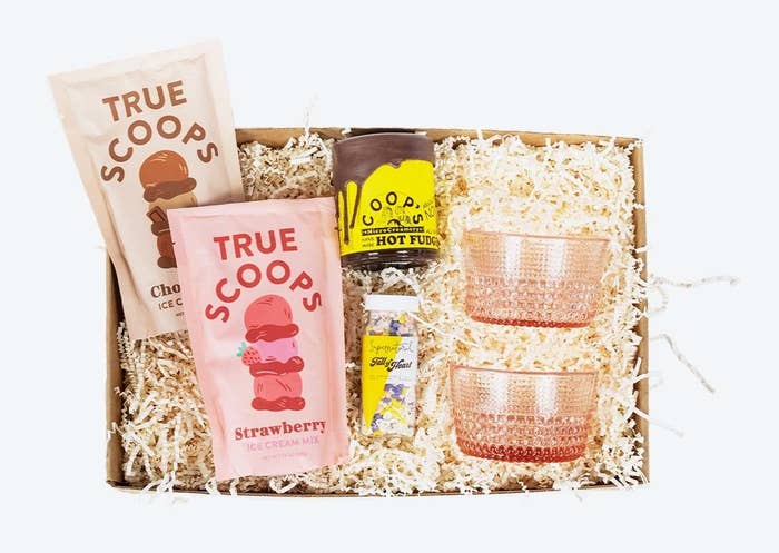 the ice cream sundae gift box with strawberry and chocolate mixes, hot fudge, rainbow sprinkles, and two bowls