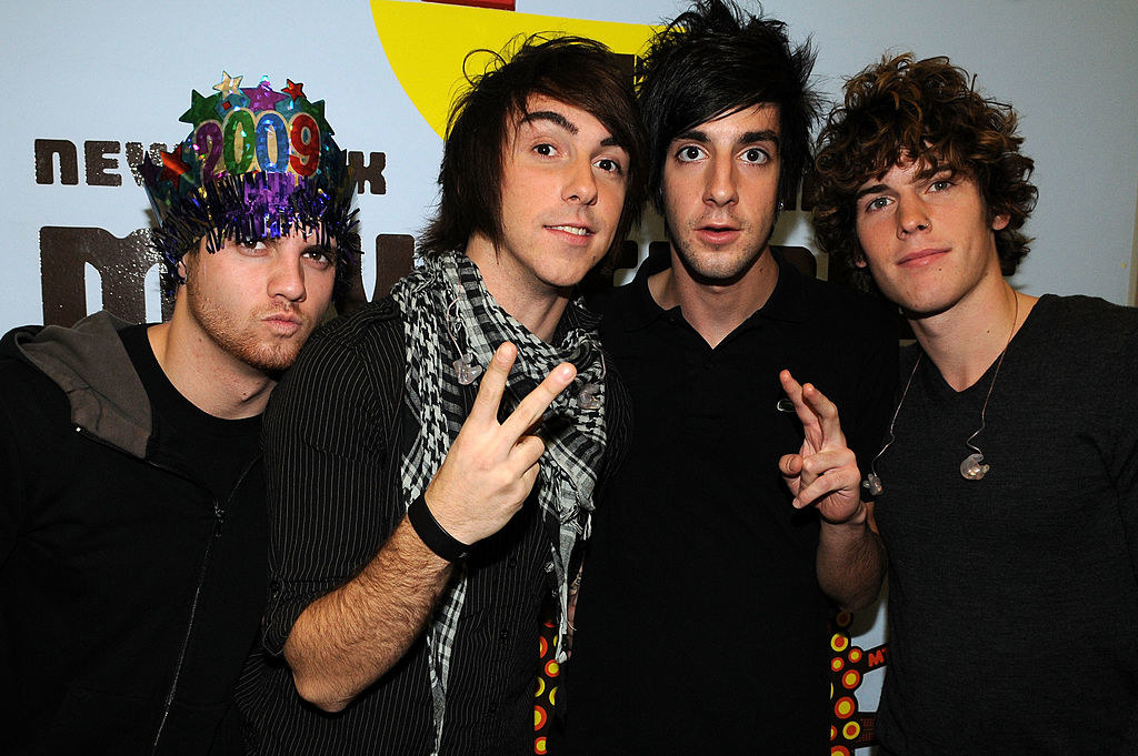 All Time Low members Alex Gaskarth, Jack Barakat, Zack Merrick, and Rian Dawson pose at the 2009 MTV New Year&#x27;s Eve program