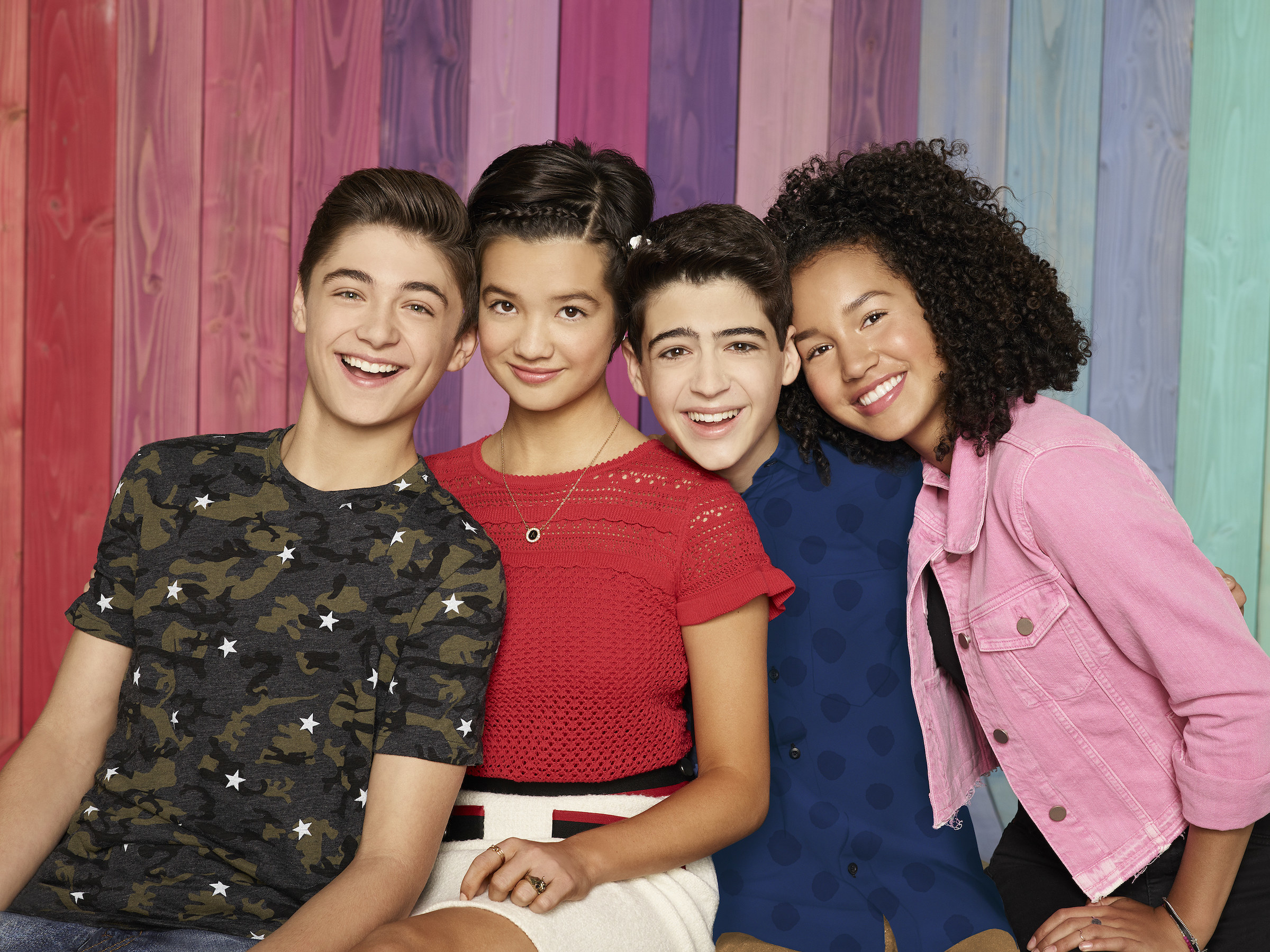 The cast of Andi Mack sit together
