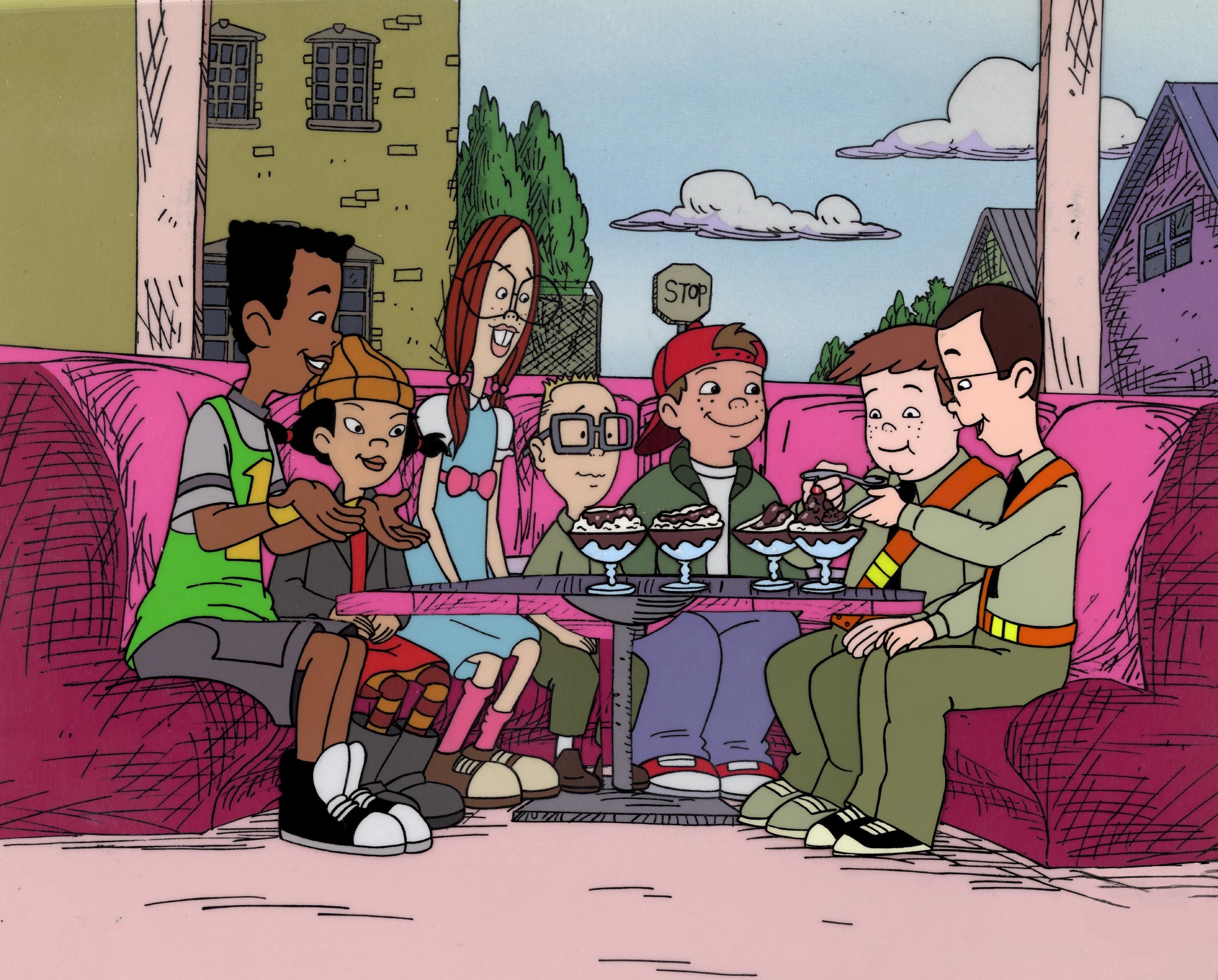The cast of Recess sit on a couch as they eat ice cream