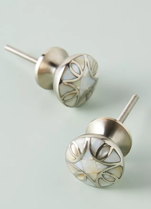 An image of a set of two mother-of-pearl doorknobs
