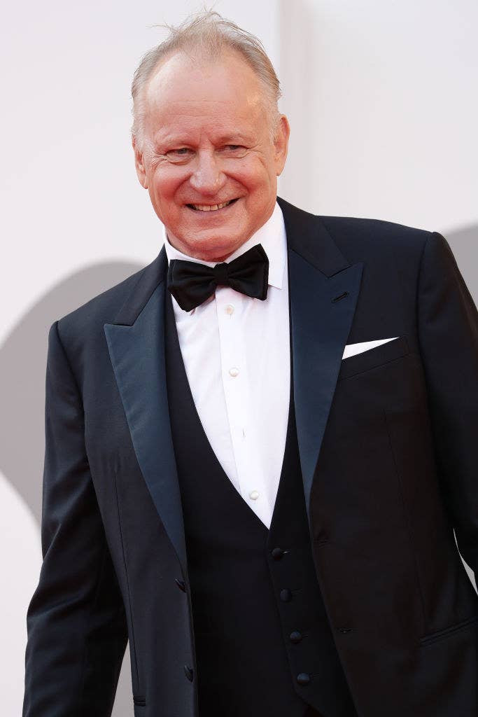 Stellan smiling on the red carpet in a tuxedo