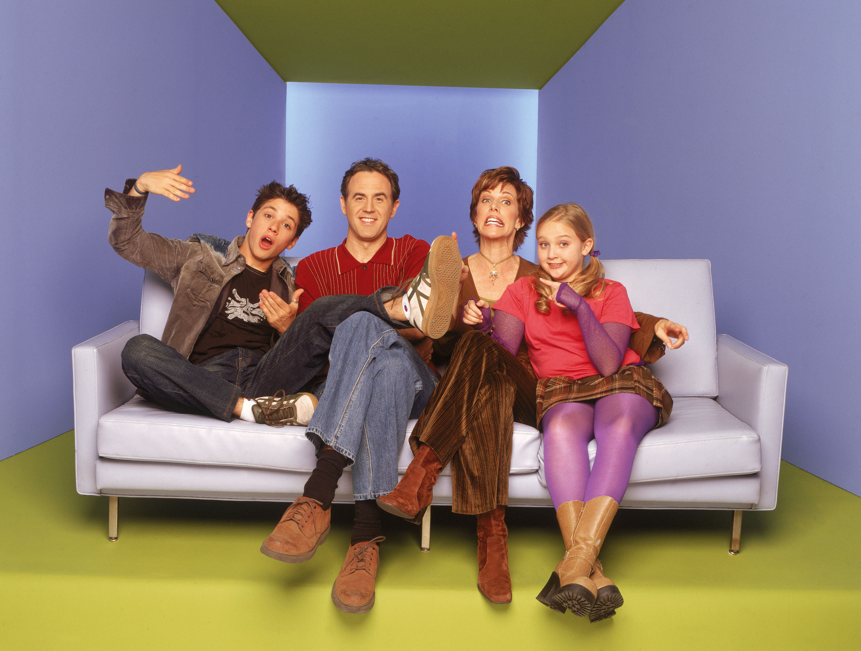 The cast of Phil of the Future sit on a couch
