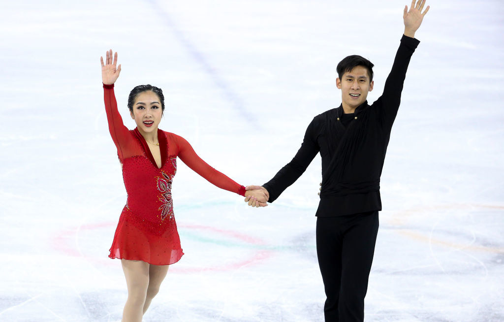 Wenjing and Cong waving in 2018