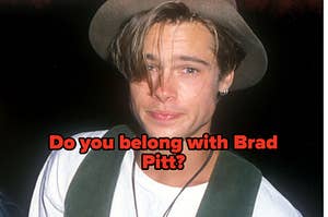 A close up of Brad Pitt as he wears a wide brim hat