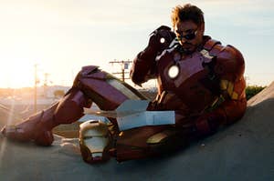 Tony Stark sits in a donut sign in the Iron Man suit