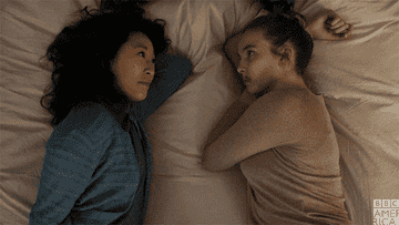 Villanelle pushing Eve&#x27;s hair back from her face in Killing Eve