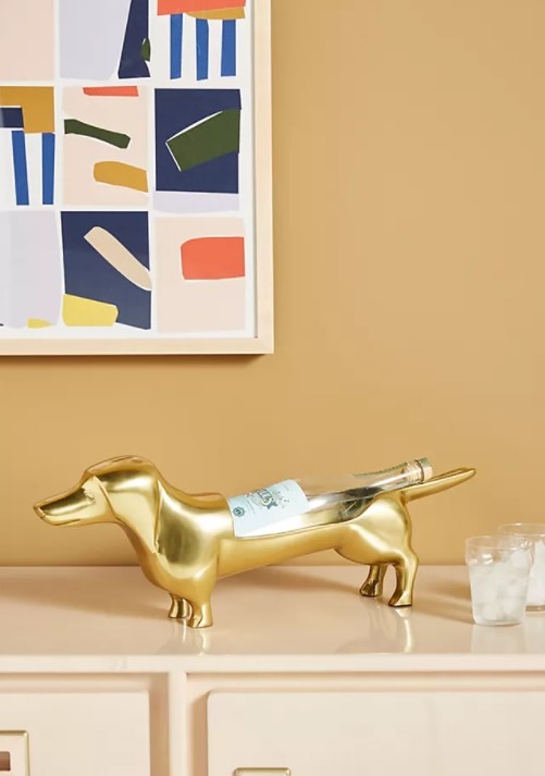 An image of a dog wine bottle holder made from handcrafted aluminum