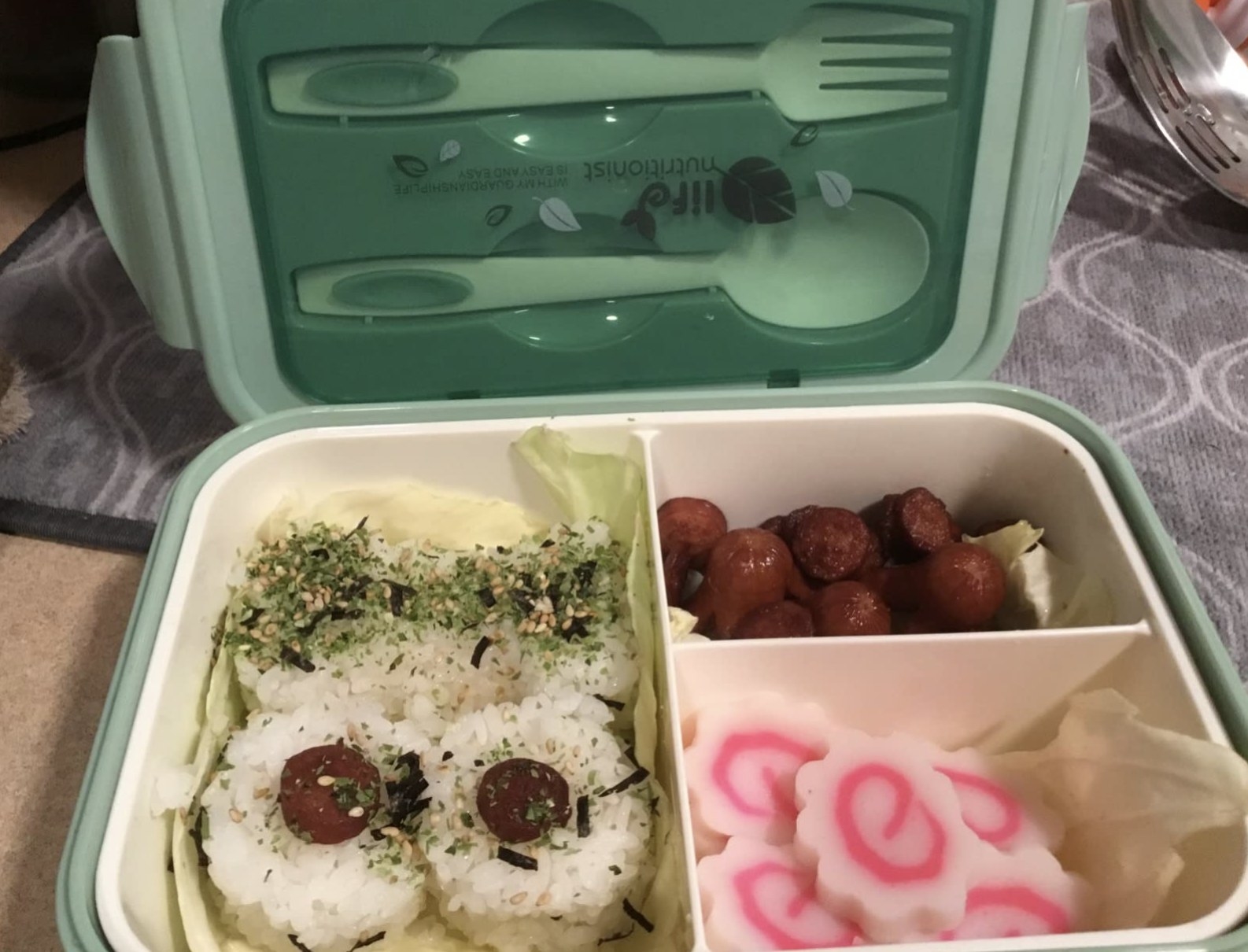 a reviewer&#x27;s meal inside of the three different compartments in this bento box