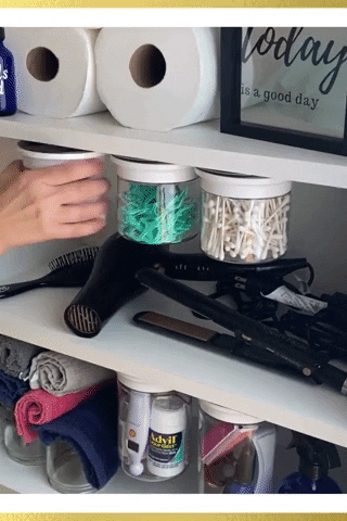 a gif of someone moving the canisters and grabbing a cotton ball