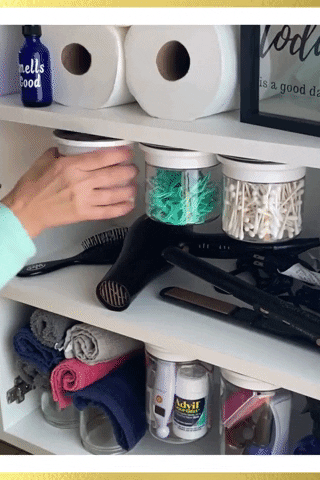 a gif of someone moving the canisters and grabbing a cotton ball