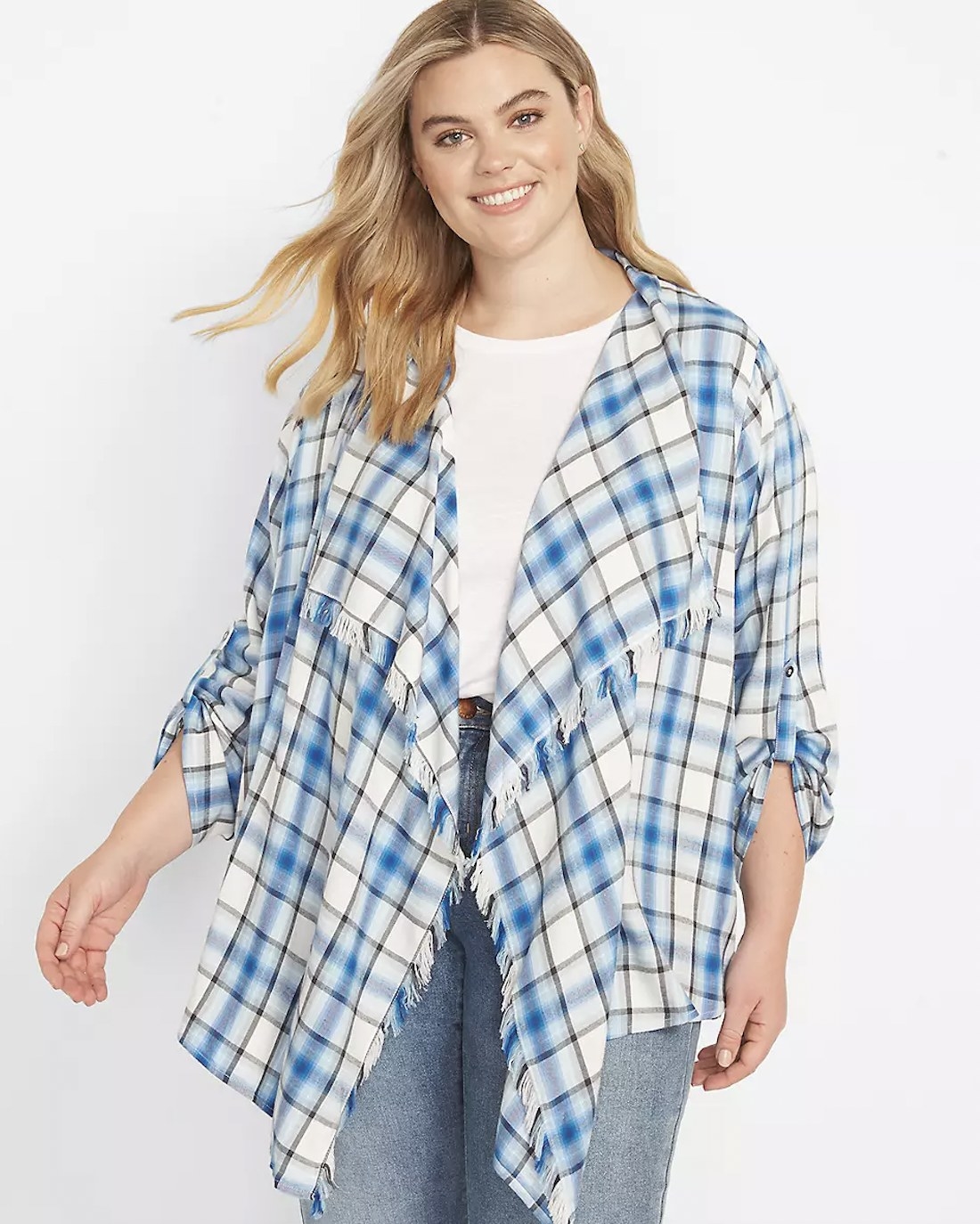 A person wearing a blue and white plaid shawl