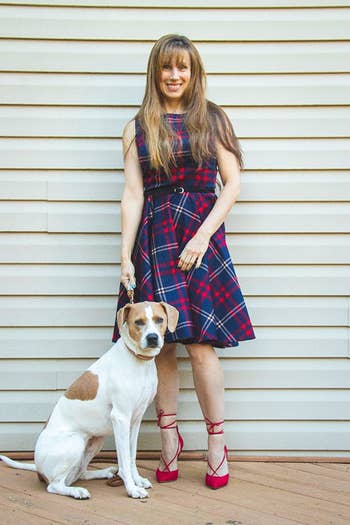 Reviewer photo of them wearing a blue and red plaid dress