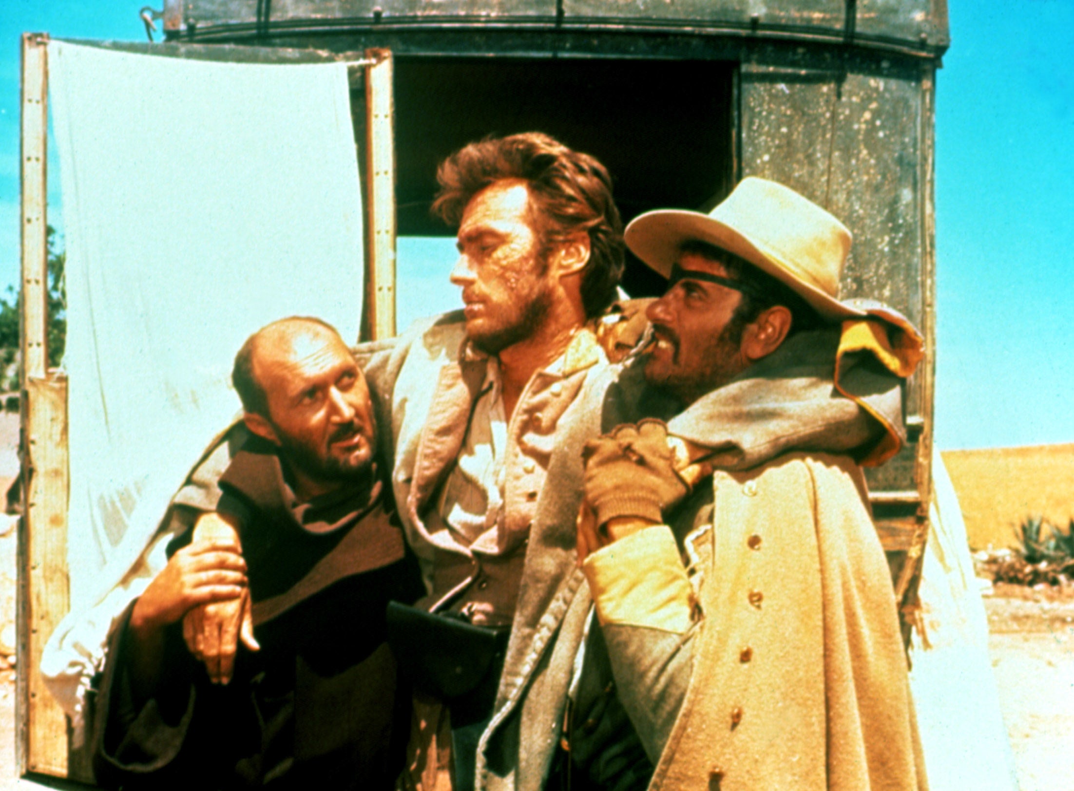 Clint Eastwood is carried through the desert