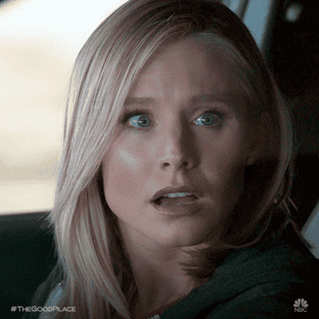 A gif of a woman looking shocked