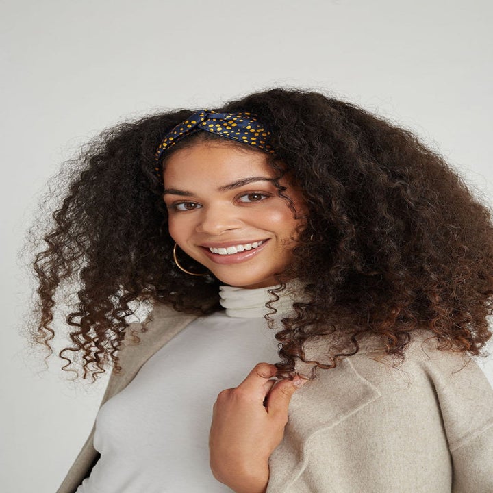 Model wearing satin-lined headband