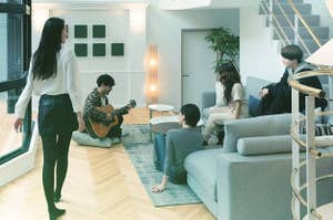 split image of a group of people listening to a roommate play the guitar 