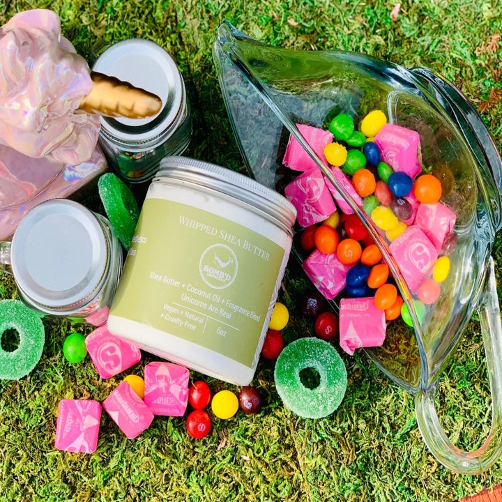 Candy and shea butter on grass