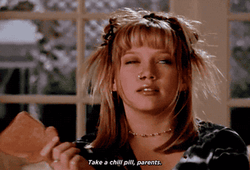 GIF of Lizzie McGuire in the show &quot;Lizzie McGuire&quot; saying, &quot;Take a chill pill, parents.&quot;