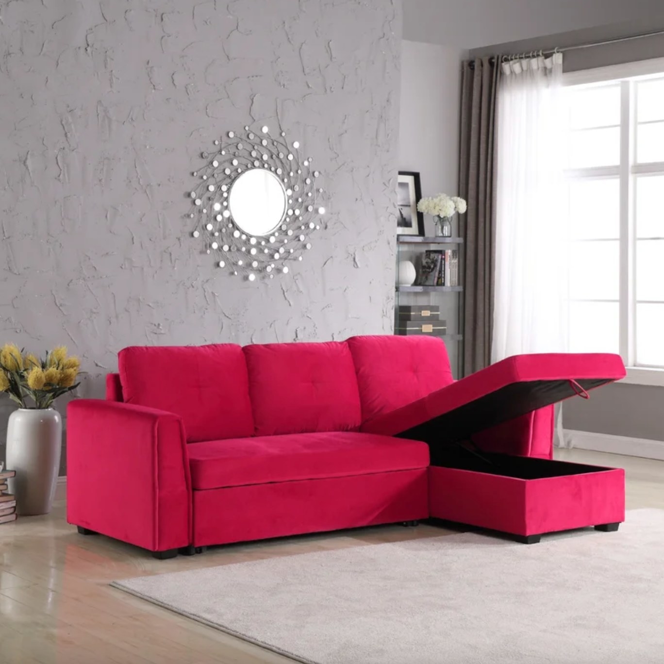 The reddish-pink velvet sofa