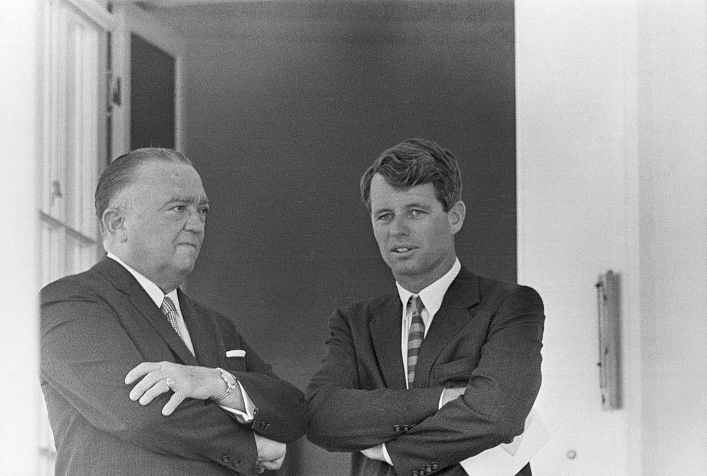 J. Edgar Hoover (left), Director of the FBI, chats with then-Attorney General Robert Kennedy during a White House ceremony on May 7, 1963