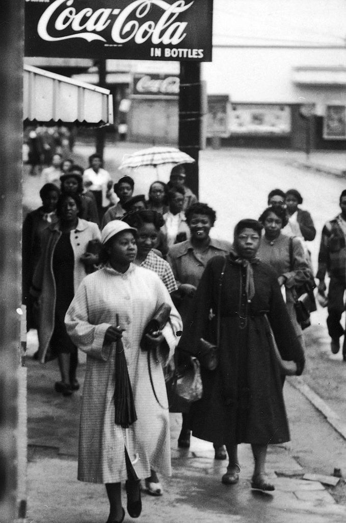 Black citizens walking to work and/or shopping