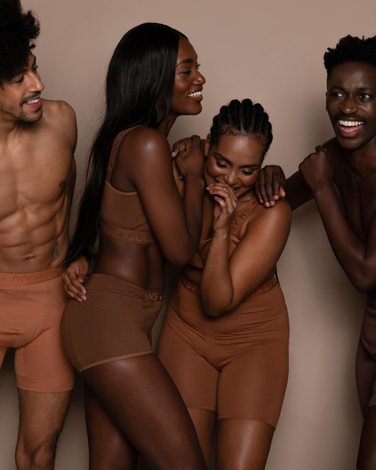 four models wearing different shades of nude underwear and bras