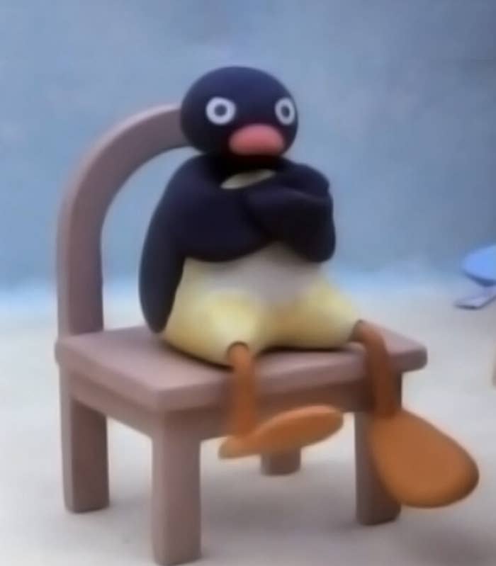 Pingu crossing arms in chair angrily meme