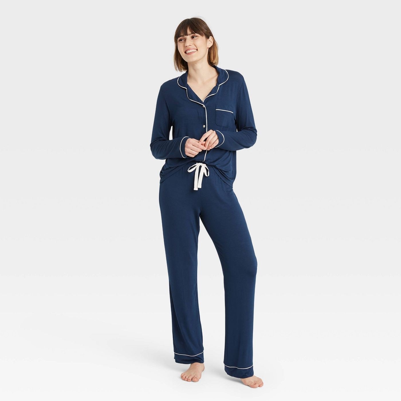 Model wearing the navy long-sleeve pajama set