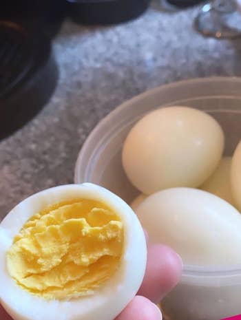Samantha Wieder showing the inside of a perfectly cooked hard boiled egg