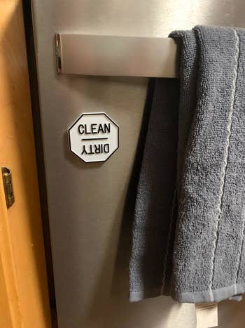 reviewer's dishwasher magnet with clean on top