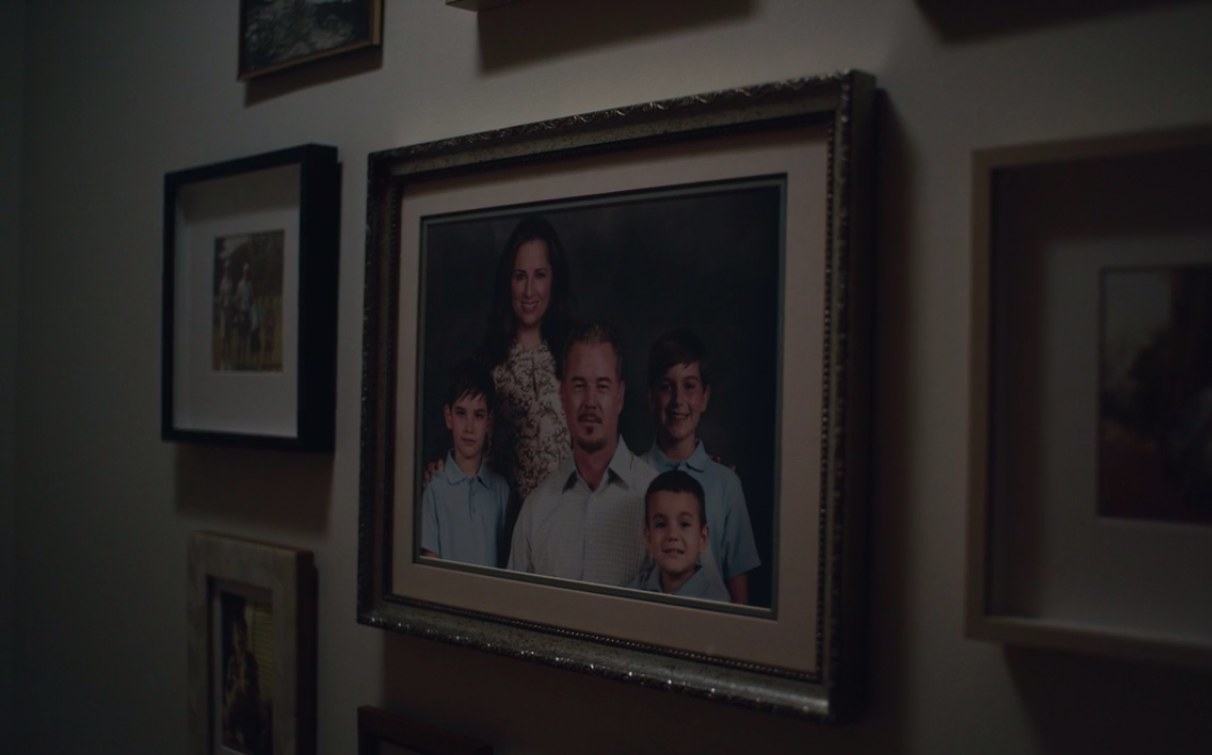 A scene from the Euphoria pilot episode showing the Jacobs family portrait on the wall