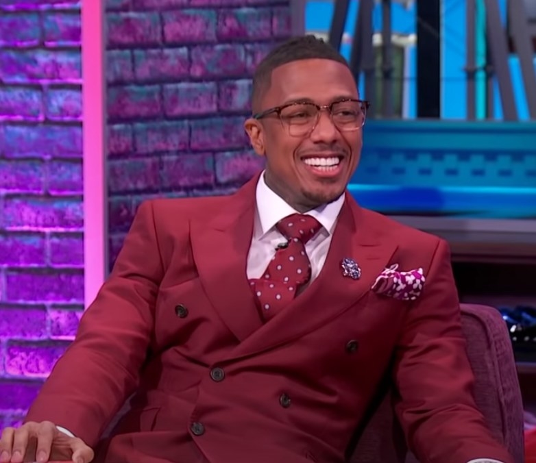Nick Cannon smiles while hosting his talk show