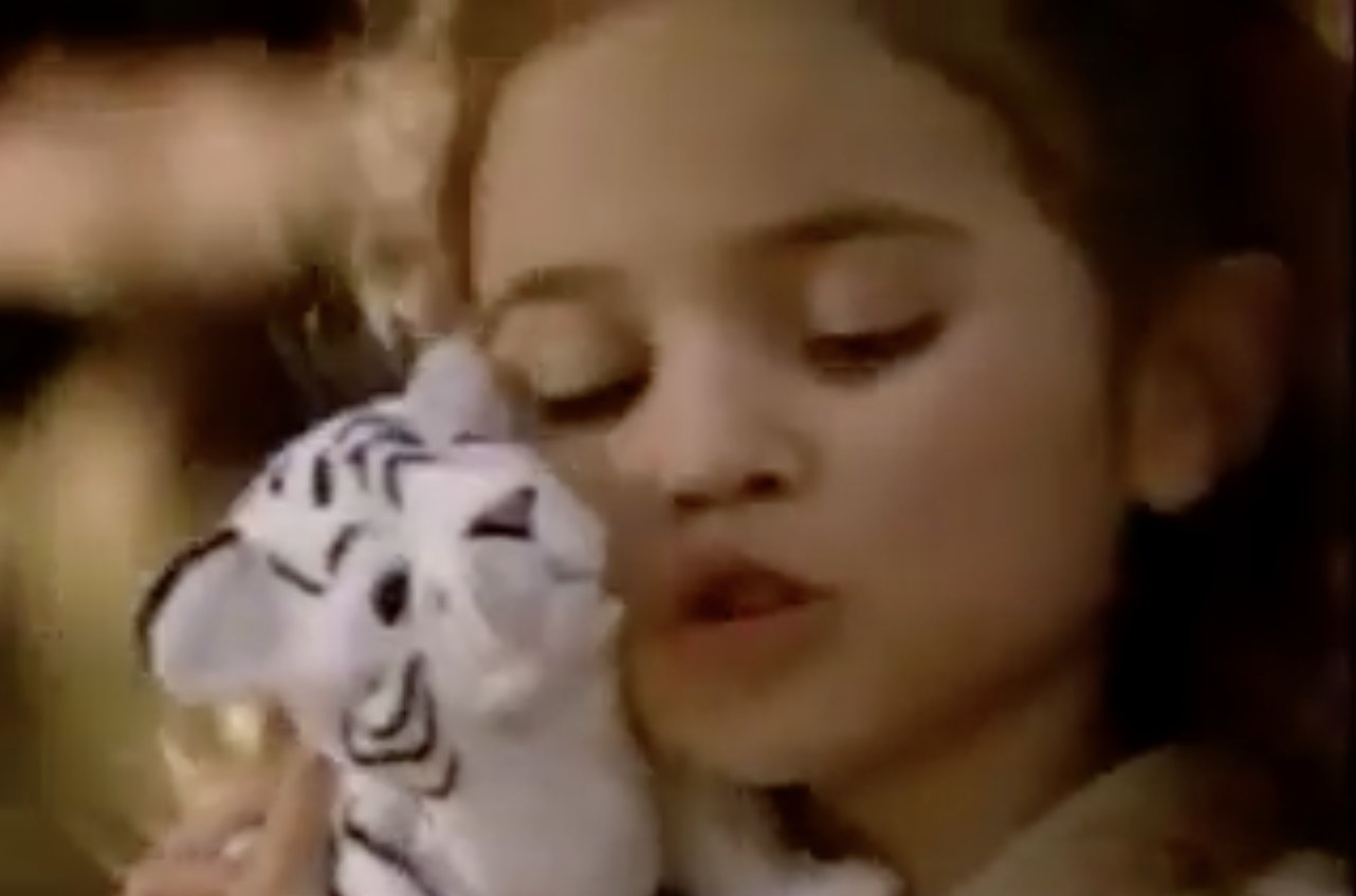 Madison Pettis huggng a FurReal Friends toy in a commercial