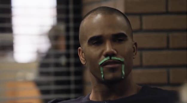 Shemar Moore with green tape on his face