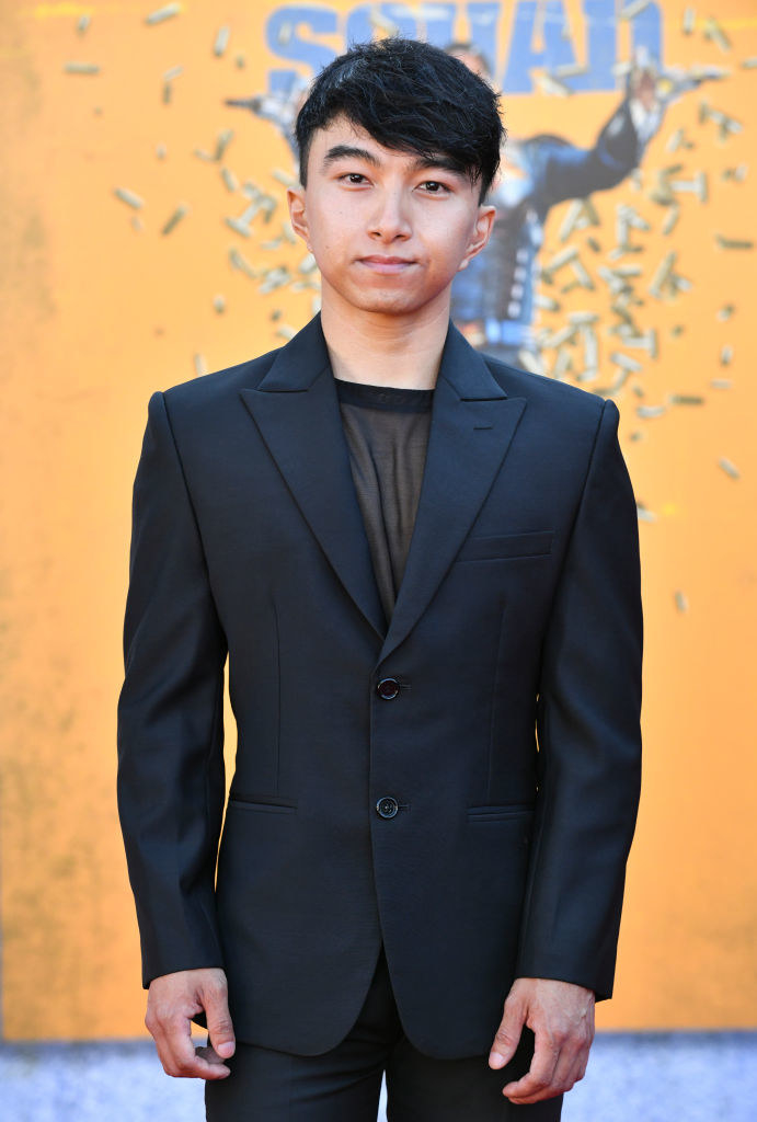 the actor wears a sleek, monochromatic suit on the red carpet