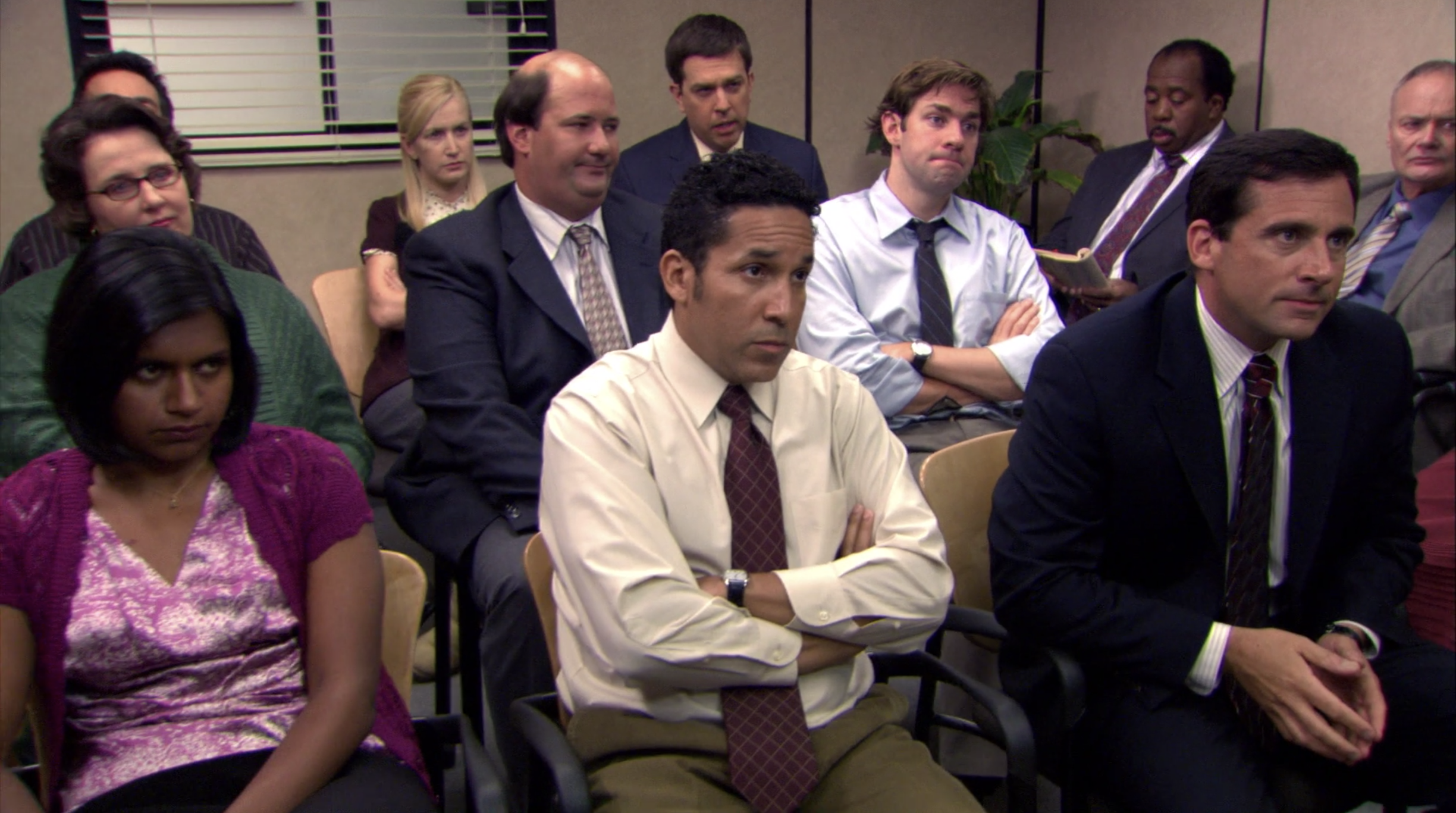 The cast of The Office sit in a room together