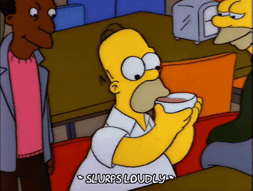 Homer Simpson slurping a bowl of soup