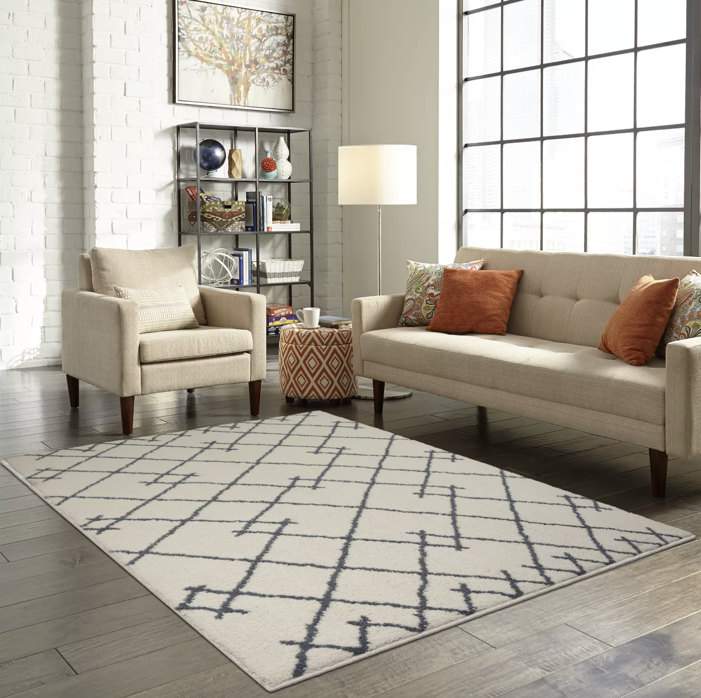 a white rug with a gray linear pattern on it