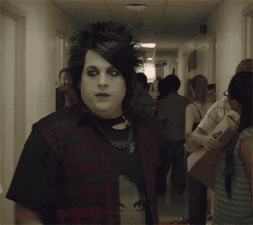 Jonah Hill as Schmidt wears goth makeup and pushes his hair out of his eyes in &quot;22 Jump Street&quot;
