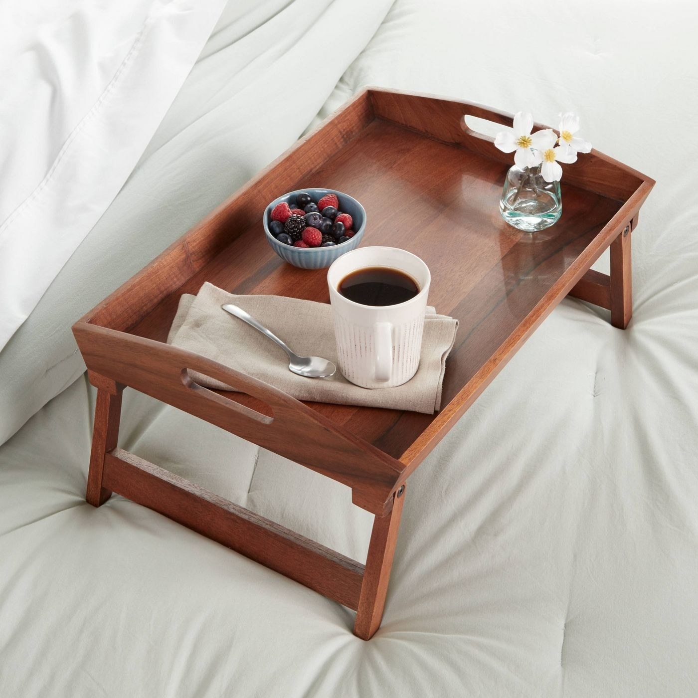 A wood bed tray