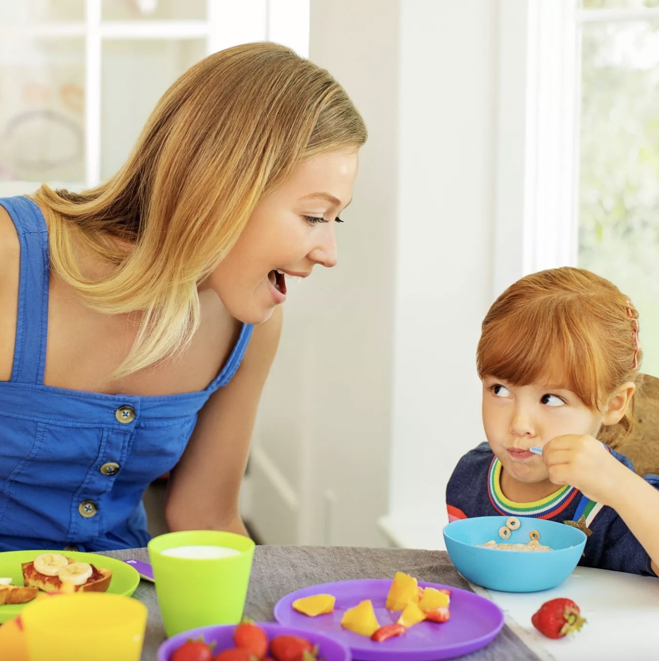 Mom and child using dining set