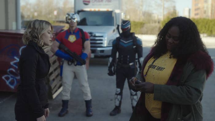 Jennifer Holland and Danielle Brooks talk as John Cena and Freddie Stroma stand in the background