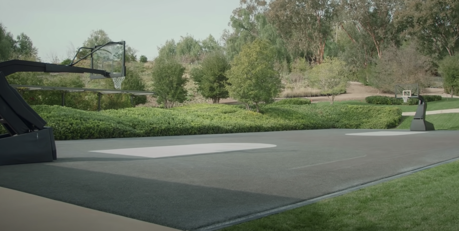 a basketball court in the backyard