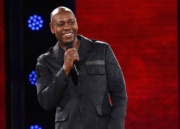 Chappelle on stage performing stand up
