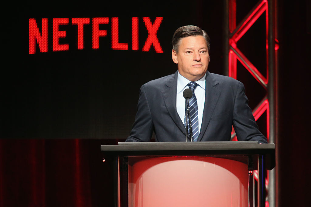 Netflix CEO, Ted Sarandos, at a podium for a Netflix event