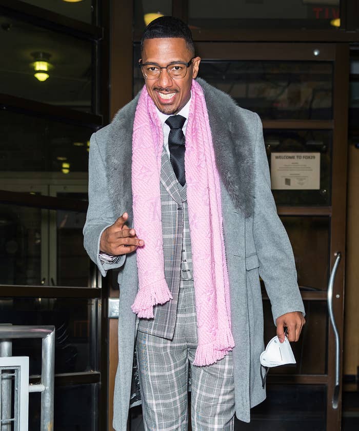 Nick Cannon in a grey suit