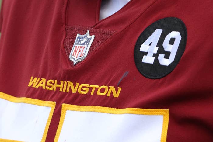 A closeup of a Washington football jerseys featuring the number 49
